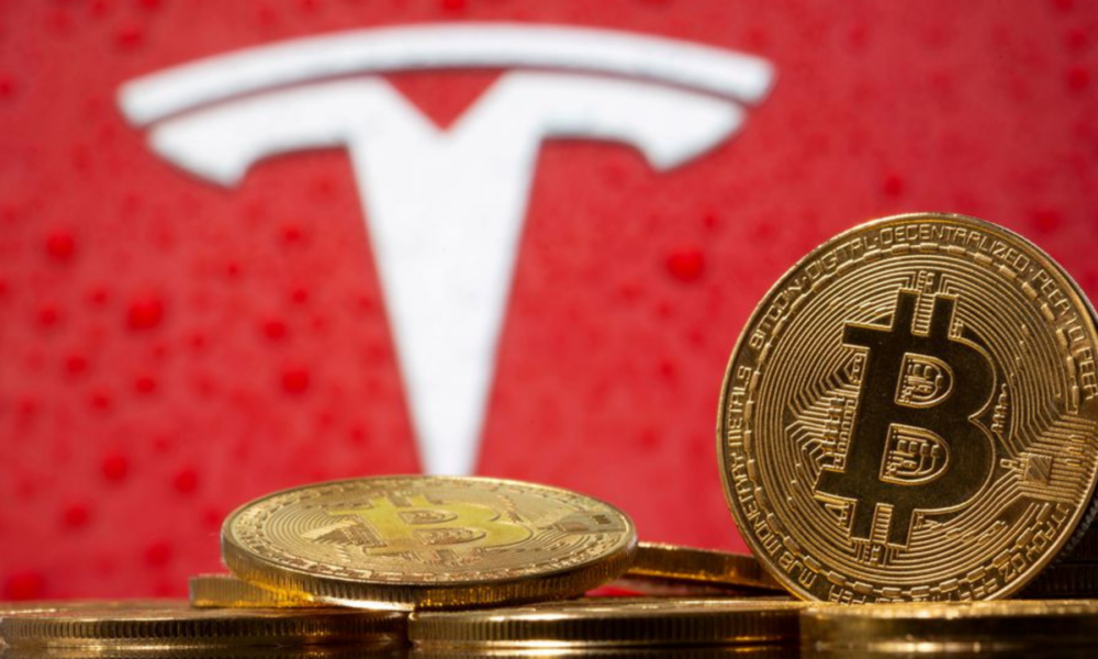 Ilustrasi Tesla jual Bitcoin.